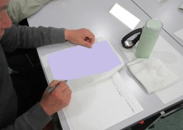 一生懸命メモを取る受講者